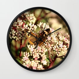 Buckeye Butterfly On Pale Pink Flowers Wall Clock